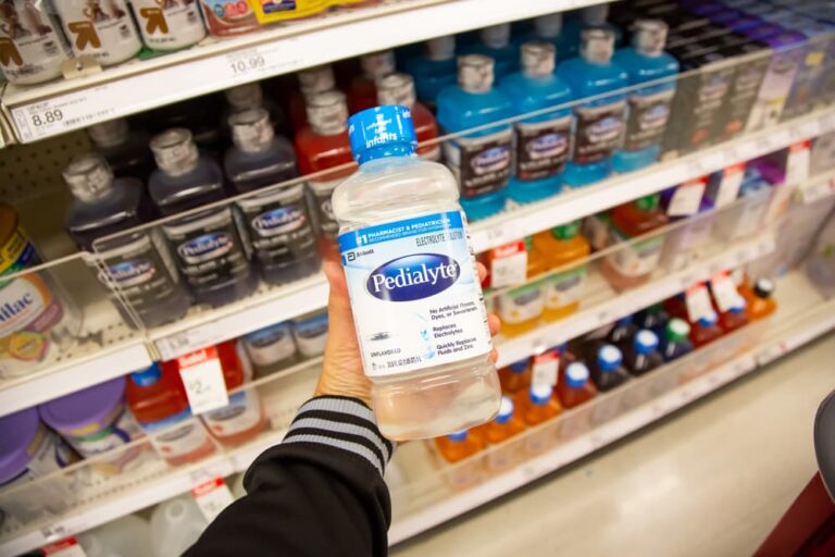 Person holding up Pedialyte in store