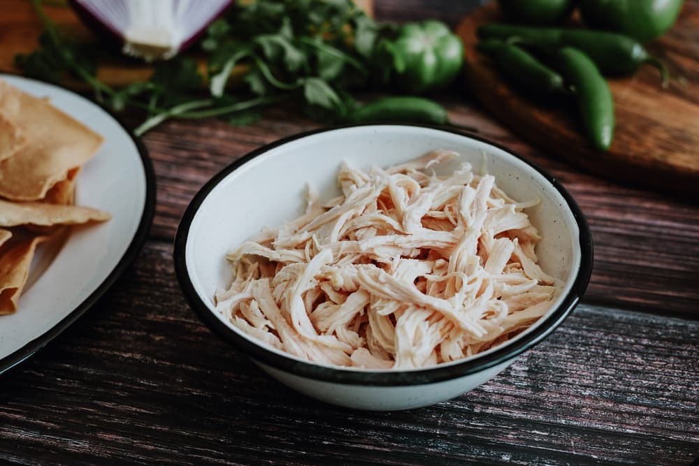 shredded boiled chicken in bowl