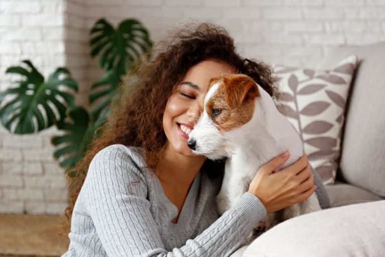 Woman hugging Jack Russell