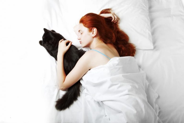 Woman asleep with cat